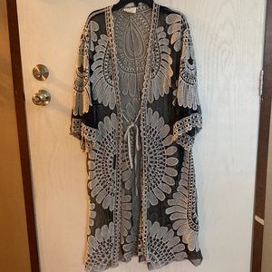 Women’s duster cardigan. Sheer, 100% polyester. Size M. Worn once.